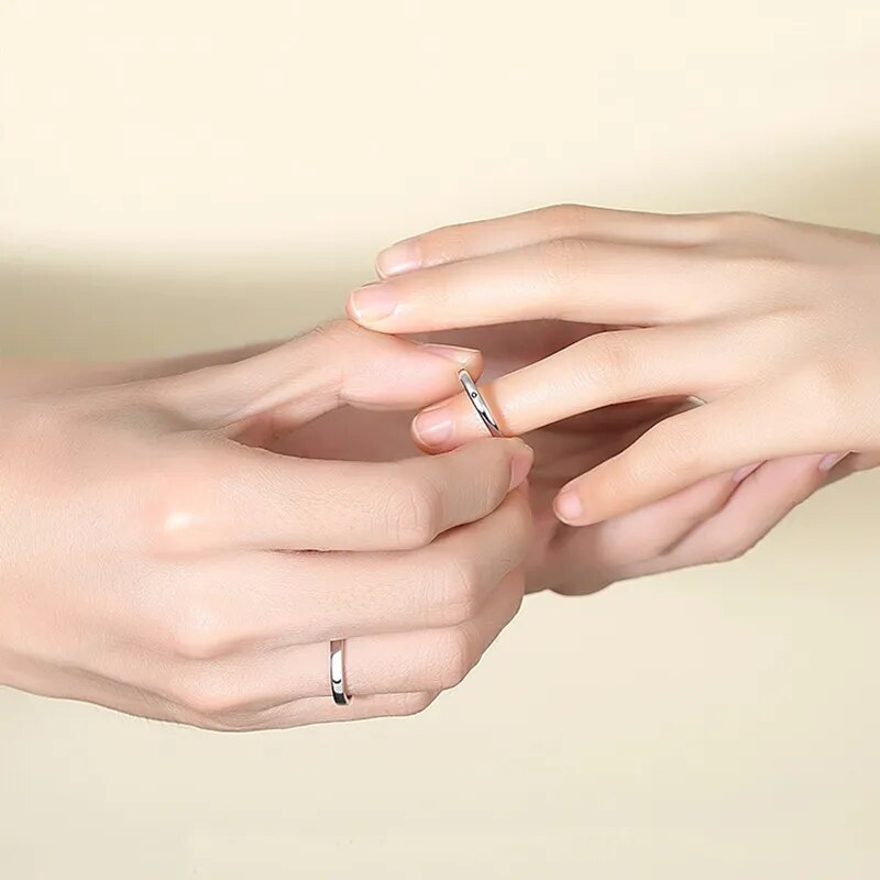 couple putting on sun and moon matching rings cute 